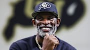 Apr 4, 2025; Boulder, CO, USA; Colorado Buffaloes head coach Deion Sanders watches as his players go through drills at the University of Colorado NFL Showcase at the CU Indoor Practice Facility. Mandatory Credit: Michael Ciaglo-Imagn Images