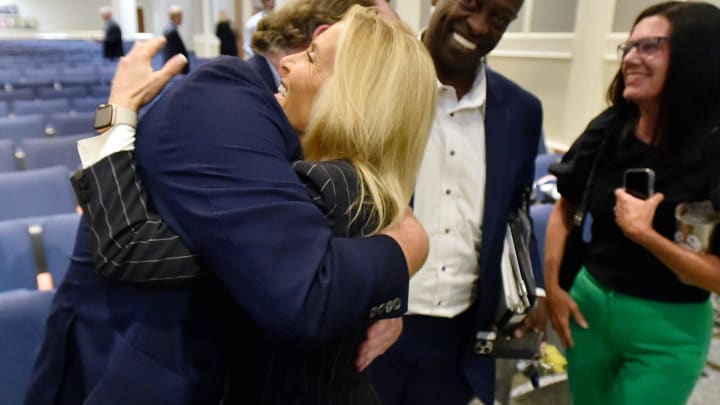 Jacksonville Mayor Donna Deegan and Jacksonville Jaguars President Mark Lamping embrace after the city council passed the stadium renovation deal Tuesday evening. By a vote of 14 to 1 with two members abstaining and two absent, Jacksonville's City Council voted to approve the city's stadium renovation deal with the Jacksonville Jaguars at the end of the City Council meeting Tuesday evening, June 25, 2024. [Bob Self/Florida Times-Union]