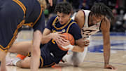 Mar 11, 2025; Charlotte, NC, USA; California Golden Bears guard Andrej Stojakovic (2) and Virginia Tech Hokies forward Mylyjael Poteat (34) try for the loose ball during the second half at Spectrum Center. Mandatory Credit: Jim Dedmon-Imagn Images