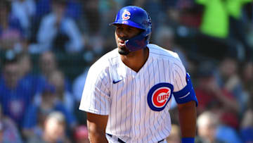 Mar 21, 2022; Mesa, Arizona, USA; Chicago Cubs right field Brennen Davis reacts after being hit by a
