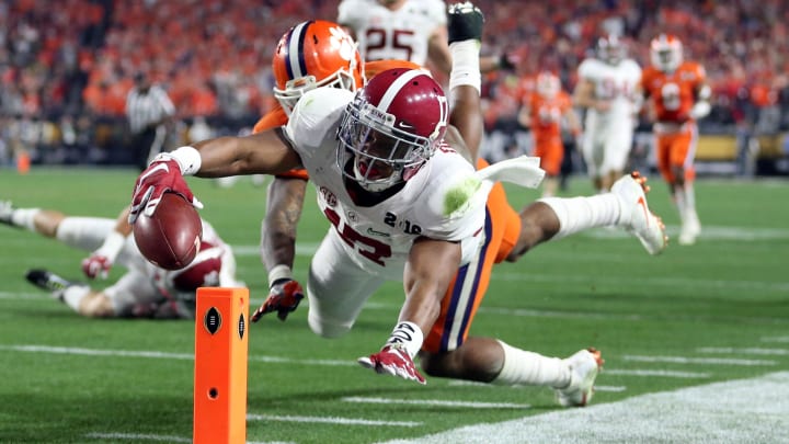 Jan 11, 2016; Glendale, AZ, USA; Alabama Crimson Tide running back Kenyan Drake (17) gets past Clemson Tigers safety T.J. Green (15) to score a touchdown on a kick return during the fourth quarter in the 2016 CFP National Championship at University of Phoenix Stadium. Mandatory Credit: Mark J. Rebilas-USA TODAY Sports