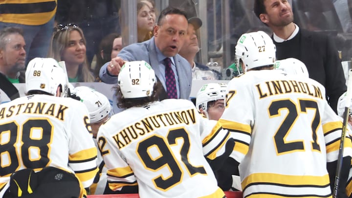 Mar 8, 2026; Pittsburgh, Pennsylvania, USA;  Boston Bruins head coach Marco Sturm (middle) talks to his team against the Pittsburgh Penguins during the third period at PPG Paints Arena. Mandatory Credit: Charles LeClaire-Imagn Images
