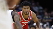 Mar 21, 2025; Cleveland, OH, USA;  New Mexico Lobos guard Donovan Dent (2) dribbles in the second half against the Marquette Golden Eagles during the NCAA Tournament First Round at Rocket Arena. Mandatory Credit: Rick Osentoski-Imagn Images
