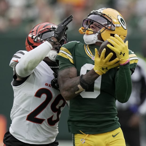 Green Bay Packers receiver Matthew Golden makes a catch while being covered by Cincinnati Bengals cornerback Cam Taylor-Britt