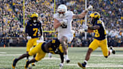 Oregon tight end Terrance Ferguson (3) runs against Michigan defensive back Zeke Berry (10) and defensive back Quinten Johnson (28) during the first half at Michigan Stadium in Ann Arbor on Saturday, Nov. 2, 2024.
