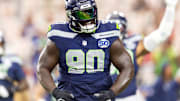 Sep 25, 2025; Glendale, Arizona, USA; Seattle Seahawks tackle Jarran Reed (90) reacts against the Arizona Cardinals at State Farm Stadium.