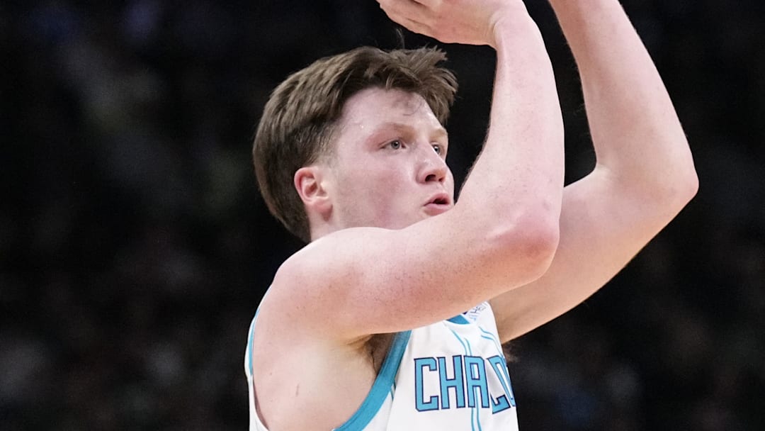 Jan 2, 2026; Milwaukee, Wisconsin, USA; Charlotte Hornets guard Kon Knueppel (7) puts up a shot against the Milwaukee Bucks in the first half at Fiserv Forum. Mandatory Credit: Michael McLoone-Imagn Images
