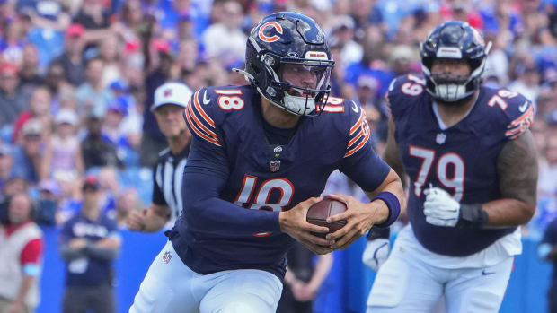 Chicago Bears QB Caleb Williams runs with the ball during preseason