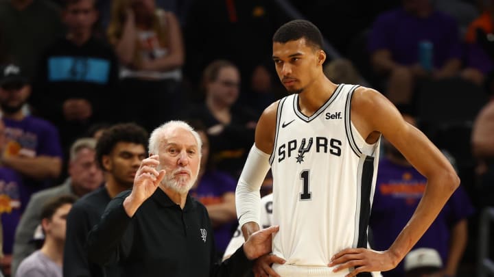 Nov 2, 2023; Phoenix, Arizona, USA; San Antonio Spurs head coach Gregg Popovich with center Victor Wembanyama (1) against the Phoenix Suns at Footprint Center. Mandatory Credit: Mark J. Rebilas-USA TODAY Sports