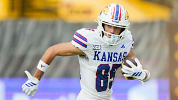 Sep 6, 2025; Columbia, Missouri, USA; Kansas Jayhawks wide receiver Tate Nagy (85) runs with the ball during the first half against the Missouri Tigers at Faurot Field at Memorial Stadium. Mandatory Credit: Jay Biggerstaff-Imagn Images