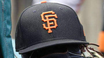 Jul 14, 2023; Pittsburgh, Pennsylvania, USA;  San Francisco Giants hat and glove on the bench against the Pittsburgh Pirates during the first inning at PNC Park. 