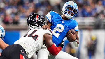 Detroit Lions quarterback Hendon Hooker (2) is sacked by Houston Texans defensive tackle Haggai Ndubuisi (64) during the second half at Ford Field in Detroit on Saturday, August 23, 2025.