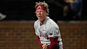 Arkansas left fielder Charles Davalan (24) reacts after he safely reached home against Vanderbilt on a double hit by Kuhio Aloy during the ninth inning at Hawkins Field in Nashville, Tenn.