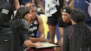 Mar 5, 2025; Greenville, South Carolina, USA; Texas A&M coach Joni Taylor talks with players during the first quarter of the Southeastern Conference Women's Basketball Tournament game with Tennessee at Bon Secours Wellness Arena.  Mandatory Credit: Ken Ruinard/USA TODAY NETWORK via Imagn Images
