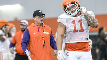 Clemson defensive coordinator Tom Allen near defensive lineman Peter Woods (11) during the football practice at the Allen N. Reeves Football Complex at Clemson University in Clemson, S.C. Wednesday, March 5, 2025.