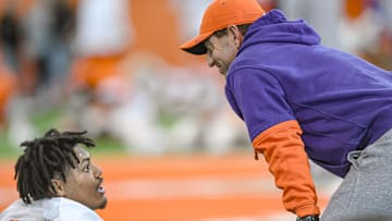 Clemson defensive end T.J. Parker (3) speaks with Clemson head coach Dabo Swinney during the football practice at the Allen N. Reeves Football Complex at Clemson University in Clemson, S.C. Wednesday, March 5, 2025.