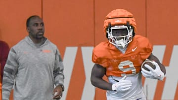 Clemson running back Gideon Davidson (9) catches a kickoff near offensive run game coach C.J. Spiller during the football practice at the Allen N. Reeves Football Complex at Clemson University in Clemson, S.C. Monday, March 3, 2025.