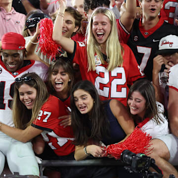 Georgia Bulldogs fans celebrate the 24-20 win over the Florida Gators by dragging players up into the stands after the second half of an NCAA football game at Everbank Stadium in Jacksonville, FL on Saturday, November 1, 2025. Georgia won 24-20. [Alan Youngblood/Gainesville Sun]