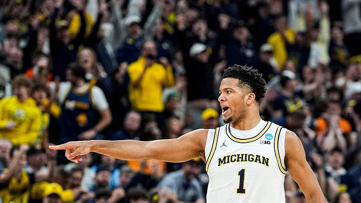 Michigan guard Trey McKenney (1) celebrates a 3-pointer against Tennessee during the first half of NCAA Tournament Elite 8 round at United Center in Chicago on Sunday, March 29, 2026.