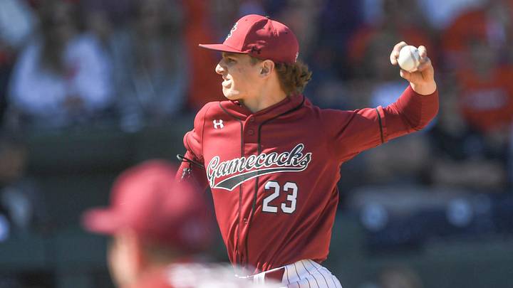 Mar 1, 2025; Greenville, South Carolina, USA; South Carolina Gamecocks pitcher Jake McCoy (23) throws to the Clemson Tigers during the top of the first inning at Fluor Field. Mandatory Credit: Ken Ruinard/USA Today Network via Imagn Images