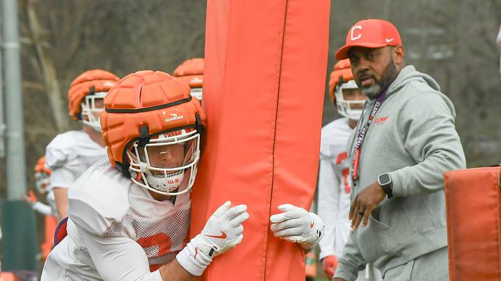 Clemson safety Tyler Venables (24) in a tackling drill with Special Teams coordinator Mike Reed during the football practice at the Allen N. Reeves Football Complex at Clemson University in Clemson, S.C. Wednesday, March 5, 2025.