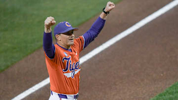 Clemson Head Coach Erik Bakich pumps his fists toward fans before the first pitch with South Carolina at Doug Kingsmore Stadium in Clemson, S.C. Wednesday, Feb 28, 2025.