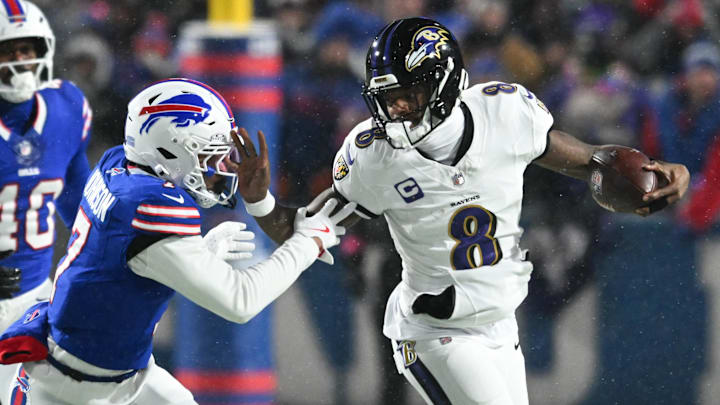 Jan 19, 2025; Orchard Park, New York, USA; Baltimore Ravens quarterback Lamar Jackson (8) runs the ball against Buffalo Bills cornerback Taron Johnson (7) during the first quarter in a 2025 AFC divisional round game at Highmark Stadium Jan 19, 2025; Orchard Park, New York, USA; Baltimore Ravens quarterback Lamar Jackson (8) runs the ball against Buffalo Bills cornerback Taron Johnson (7) during the first quarter in a 2025 AFC divisional round game at Highmark Stadium