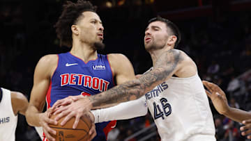 Dec 6, 2023; Detroit, Michigan, USA;  Memphis Grizzlies guard John Konchar (46) strips the ball from