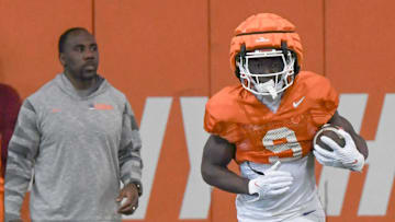 Clemson running back Gideon Davidson (9) catches a kickoff near offensive run game coach C.J. Spiller during the football practice at the Allen N. Reeves Football Complex at Clemson University in Clemson, S.C. Monday, March 3, 2025.