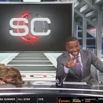 Nicole Briscoe and Ryan Smith lose it on SportsCenter. 