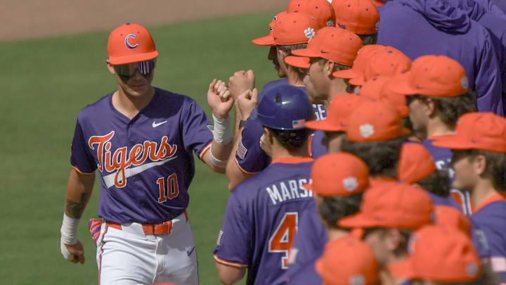 Clemson outfielder Cam Cannarella (10) fist bumps teammates as he is introduced before the game with Clemson and University of South Carolina at the Reedy River Rivalry game at Fluor Field in Greenville, S.C. Saturday, March 1, 2025.