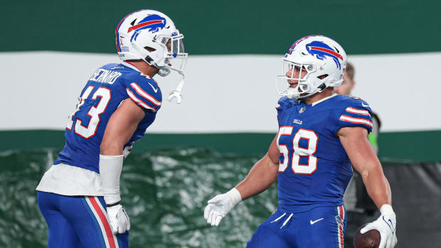 Sep 11, 2023; East Rutherford, New Jersey, USA; Buffalo Bills linebacker Matt Milano (58) reacts after his interception with linebacker Terrel Bernard (43) during the first half against the New York Jets at MetLife Stadium. Mandatory Credit: Vincent Carchietta-USA TODAY Sports