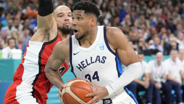 Jul 27, 2024; Villeneuve-d'Ascq, France; Greece small forward Giannis Antetokounmpo (34) controls the ball against Canada small forward Dillon Brooks (24) during the Paris 2024 Olympic Summer Games at Stade Pierre-Mauroy. Mandatory Credit: John David Mercer-USA TODAY Sports