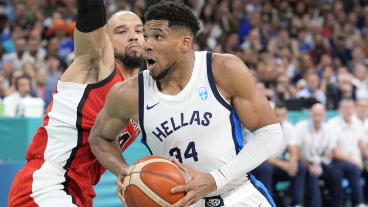 Jul 27, 2024; Villeneuve-d'Ascq, France; Greece small forward Giannis Antetokounmpo (34) controls the ball against Canada small forward Dillon Brooks (24) during the Paris 2024 Olympic Summer Games at Stade Pierre-Mauroy. Mandatory Credit: John David Mercer-USA TODAY Sports