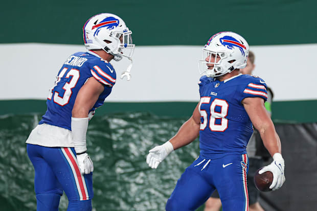 Buffalo Bills linebacker Matt Milano reacts after his interception with linebacker Terrel Bernard