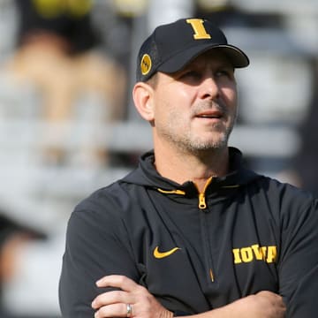 Iowa football’s offensive coordinator Tim Lester watches warmups before the game against Washington Saturday, Oct. 12, 2024 at Kinnick Stadium in Iowa City, Iowa.