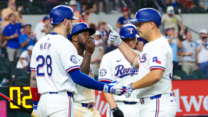 Jul 24, 2024; Arlington, Texas, USA; Texas Rangers first baseman Nathaniel Lowe (30) celebrates with teammates after hitting a three run during the eighth inning against the Chicago White Sox at Globe Life Field. Mandatory Credit: Kevin Jairaj-USA TODAY Sports