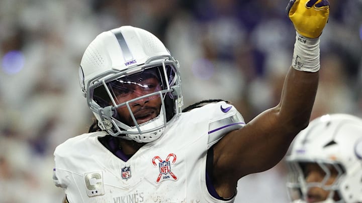 Dec 25, 2025; Minneapolis, Minnesota, USA; Minnesota Vikings running back Aaron Jones Sr. (33) celebrates after scoring a touchdown against the Detroit Lions in the first quarter at U.S. Bank Stadium. 