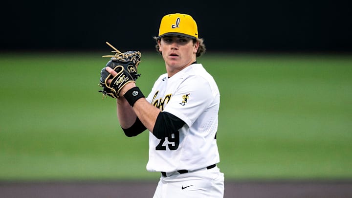 Iowa pitcher Jack Young (29) looks for a signal during a NCAA baseball game against Loras College, Tuesday, Feb. 28, 2023, at Duane Banks Field in Iowa City, Iowa.