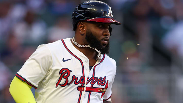 Atlanta Braves designated hitter Marcell Ozuna (20) hits a single against the New York Mets in the fourth inning at Truist Park.
