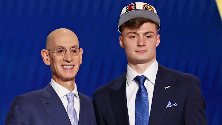 Jun 23, 2022; Brooklyn, NY, USA; Christian Braun (Kansas) shakes hands with NBA commissioner Adam Silver after being selected as the number twenty-one overall pick by the Denver Nuggets in the first round of the 2022 NBA Draft at Barclays Center. Mandatory Credit: Brad Penner-Imagn Images