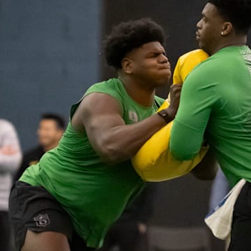 Oregon offensive lineman Josh Conerly Jr., left, runs drills with Oregon offensive lineman Marcus Harper II during the Oregon football’s Pro Day Tuesday, March 18, 2025, at the Moshofsky Center in Eugene, Ore.