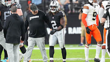 Las Vegas Raiders running back Ashton Jeanty walks slowly off the field after sustaining an injury.