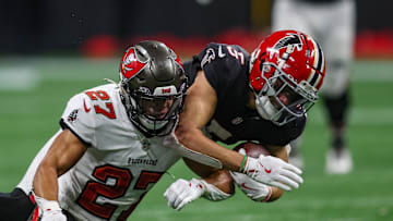 Tampa Bay Buccaneers cornerback Zyon McCollum (27) tackles Atlanta Falcons wide receiver Drake London (5) in overtime.