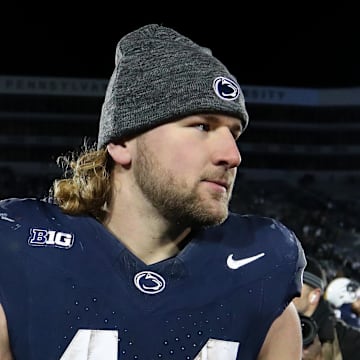 Nov 30, 2024; University Park, Pennsylvania, USA; Penn State Nittany Lions tight end Tyler Warren (44) stands on the field following a game against the Maryland Terrapins at Beaver Stadium. Penn State won 44-7. Mandatory Credit: Matthew O'Haren-Imagn Images