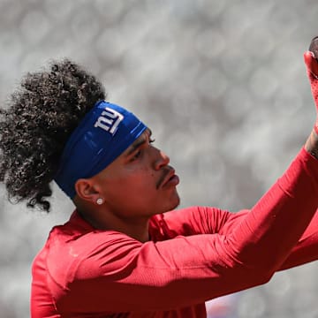 Sep 8, 2024; East Rutherford, New Jersey, USA; New York Giants wide receiver Jalin Hyatt (13) warms up before the game against the Minnesota Vikings at MetLife Stadium.  