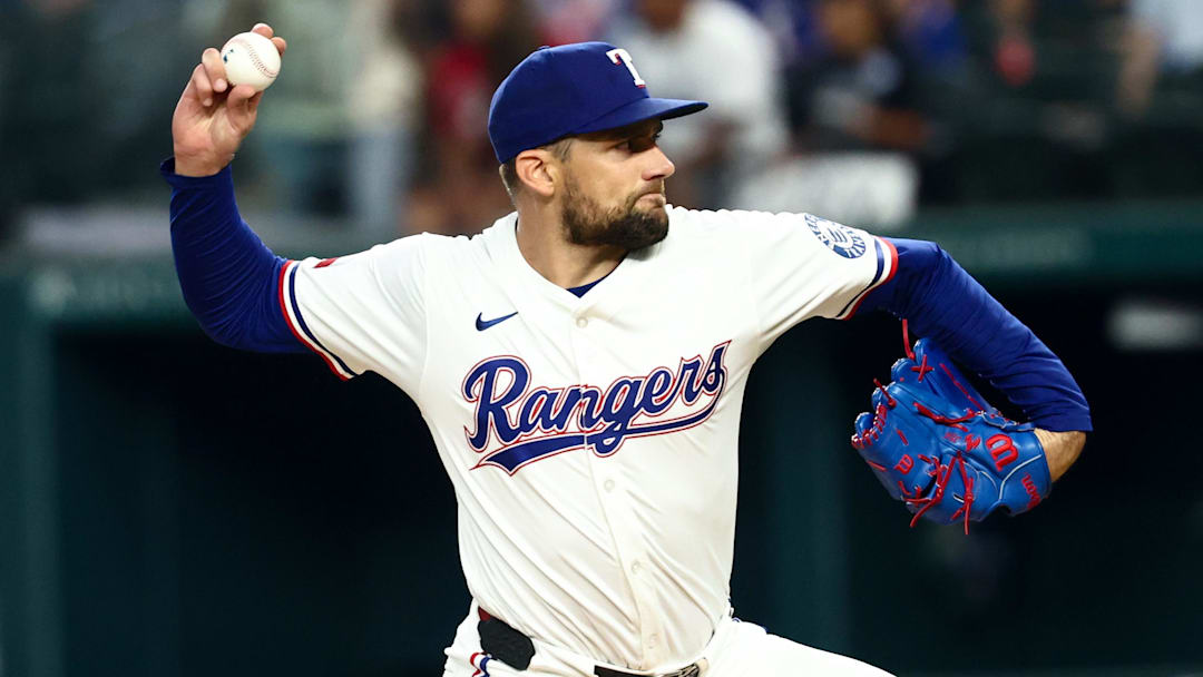 Aug 5, 2025; Arlington, Texas, USA;  Texas Rangers starting pitcher Nathan Eovaldi (17) throws during the first inning against the New York Yankees at Globe Life Field.