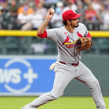 Jul 22, 2025; Denver, Colorado, USA; St. Louis Cardinals third baseman Nolan Arenado (28) fields the ball in the first inning against the Colorado Rockies at Coors Field. Mandatory Credit: Ron Chenoy-Imagn Images