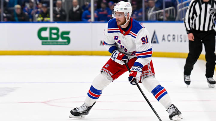 Feb 25, 2025; Elmont, New York, USA;  New York Rangers right wing Reilly Smith (91) looks to pass against the New York Islanders during the third period at UBS Arena. Mandatory Credit: Dennis Schneidler-Imagn Images