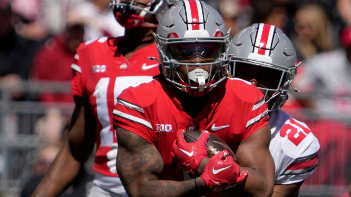 April 13, 2024; Columbus, Ohio, USA; 
Ohio State Buckeyes running back Quinshon Judkins (1) of the scarlet team is tagged by safety Jayden Bonsu (21) of the grey team during the first half of the LifeSports spring football game at Ohio Stadium on Saturday.